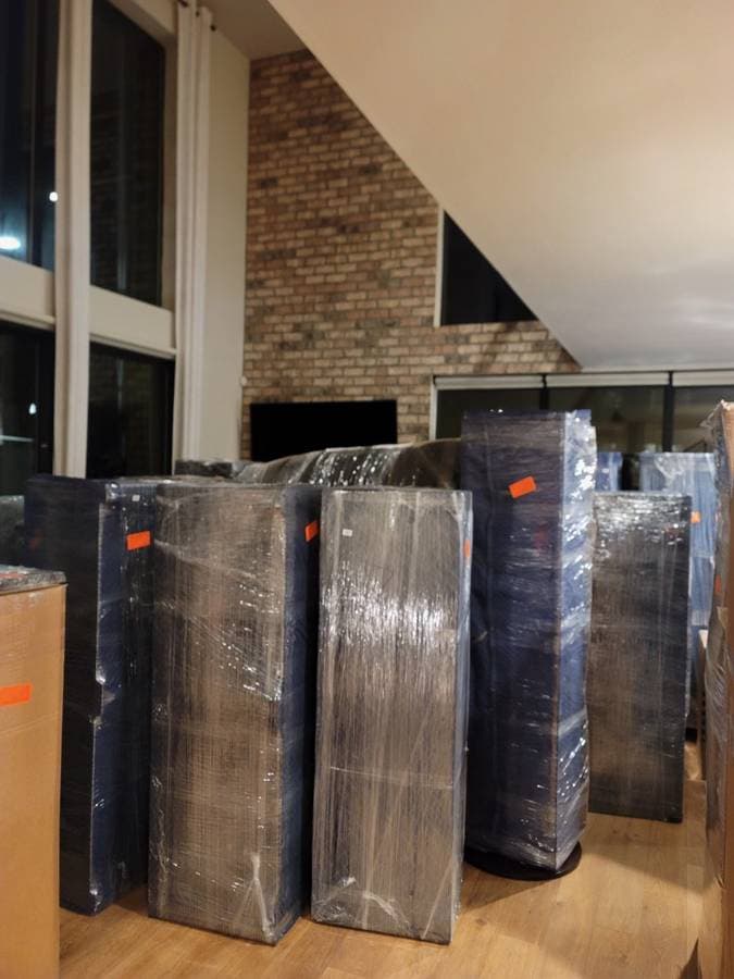 picture of furniture neatly wrapped ready to be moved by a moving company